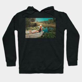 woman floating among waterlilies Hoodie